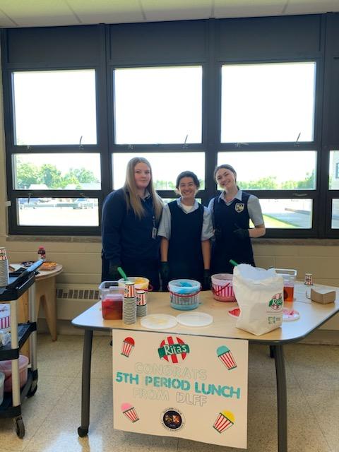 students serving water ice during lunch